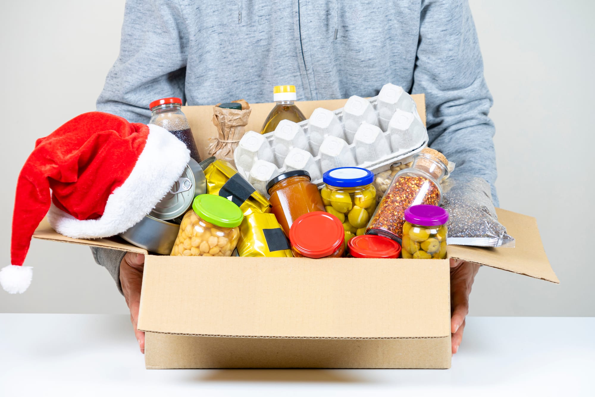 A box filled with food items, spreading joy this giving season