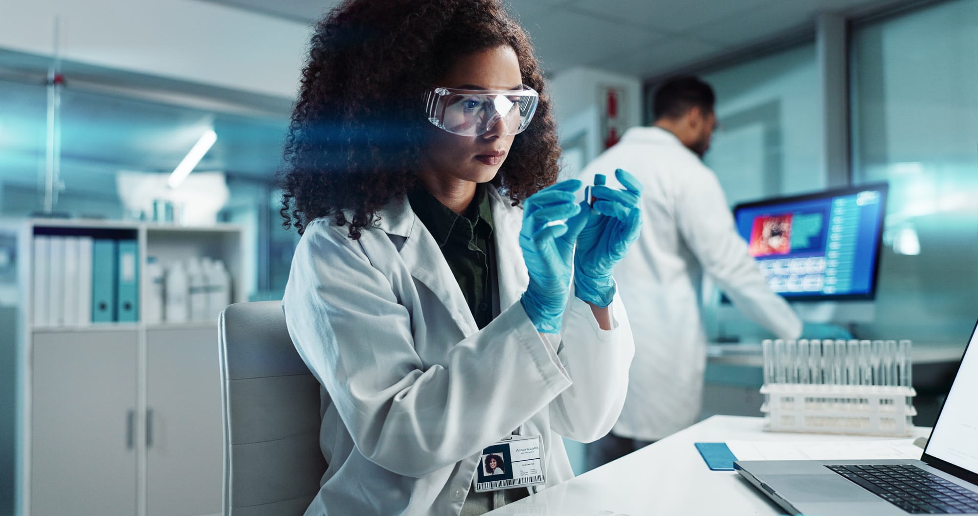 A scientist working on a product prototype in a lab.