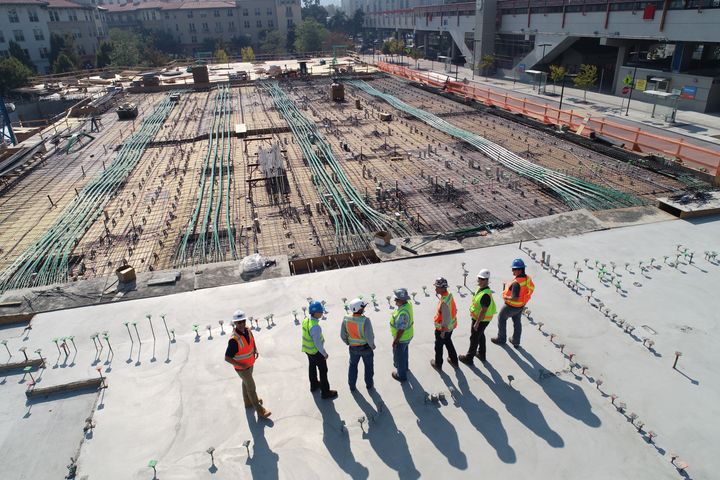 Construction workers overviewing a site.